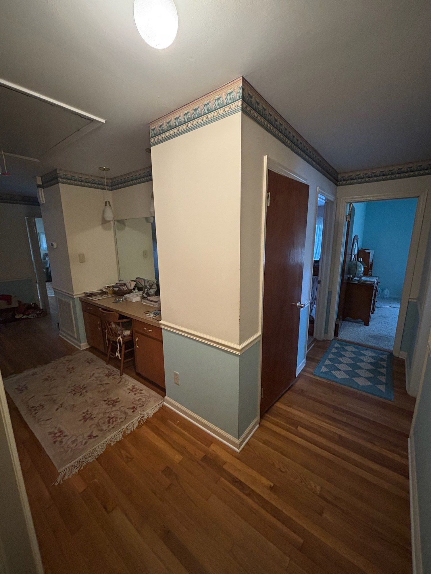 Original hallway with built-in desk and wallpaper border