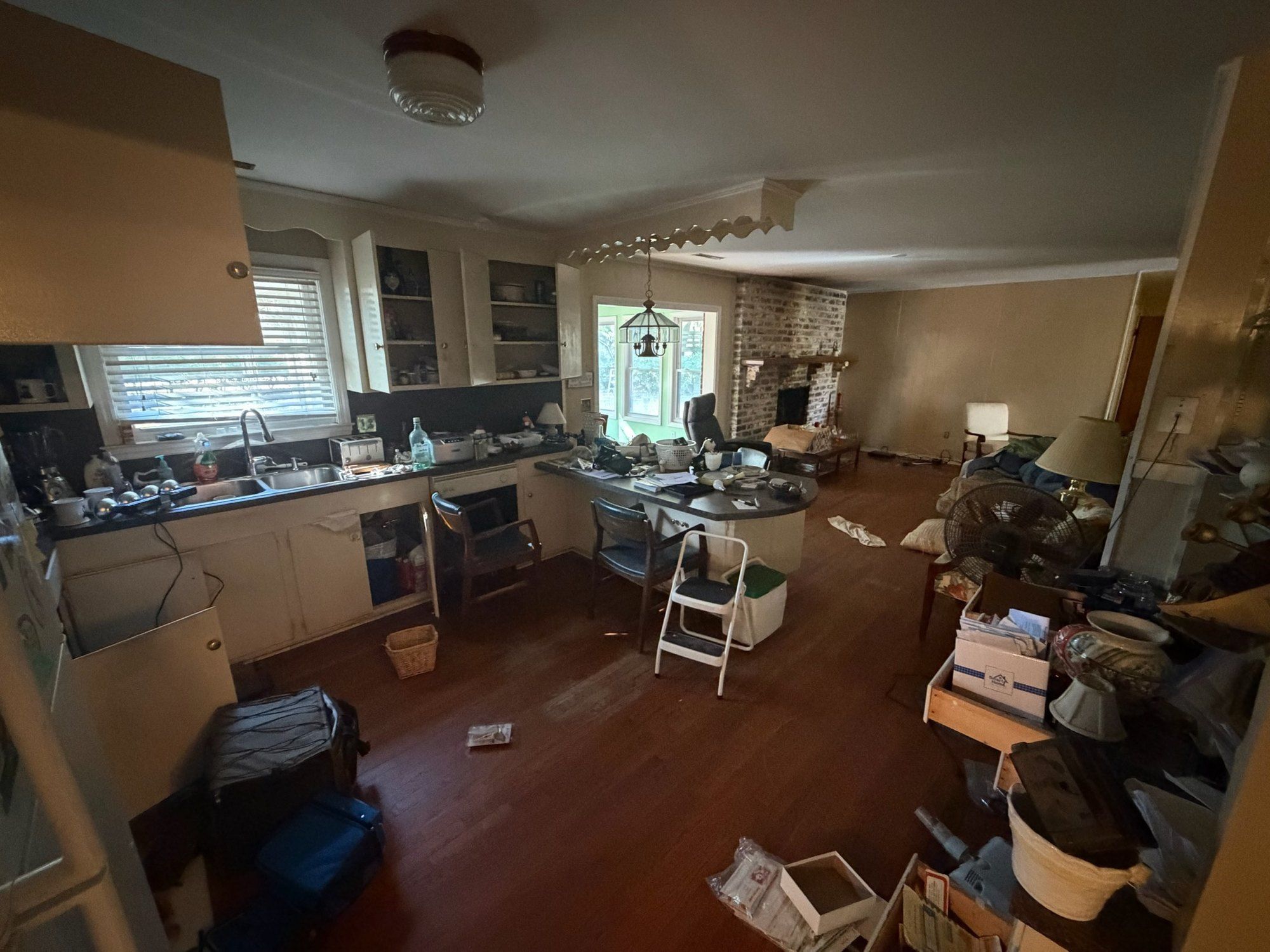 Original kitchen looking toward the brick fireplace